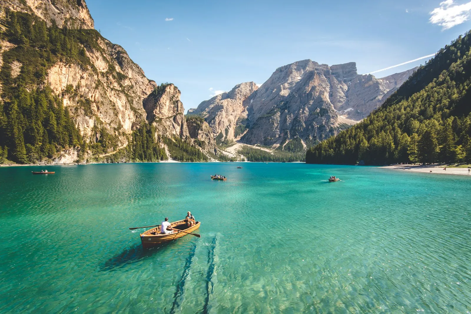 A lone boat on a still alpine lake